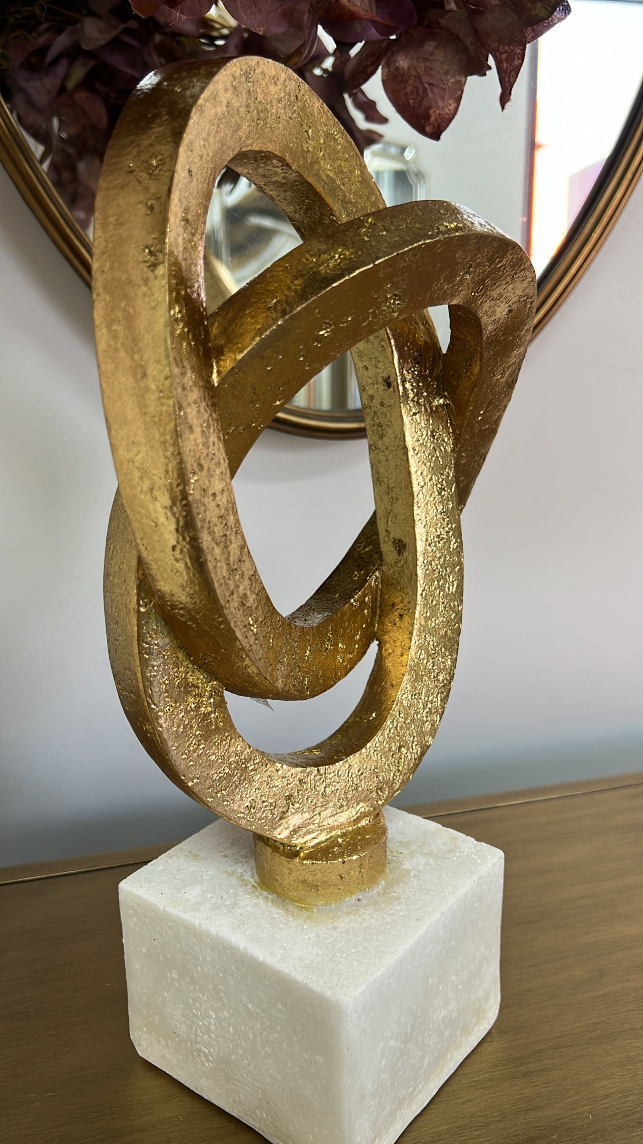 Gold loop sculpture abstract