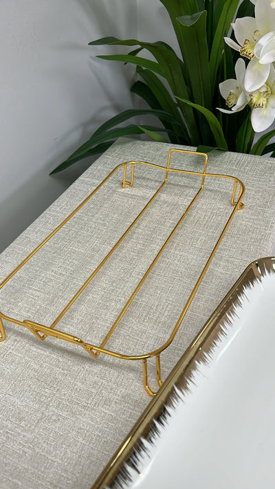 gold and white rectangular rack serving platter