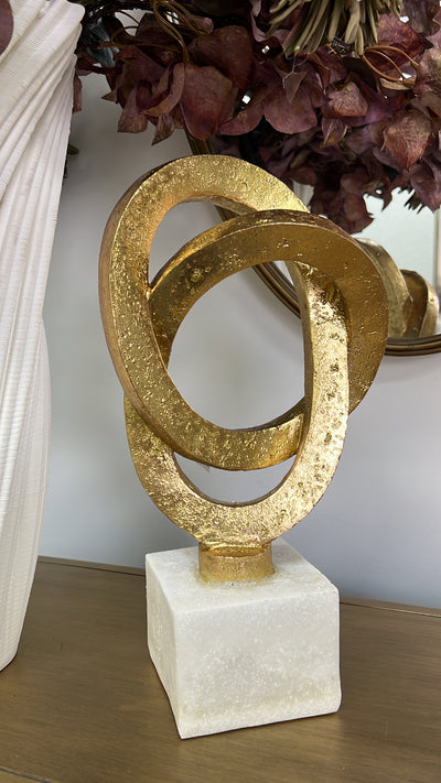 Gold loop sculpture abstract