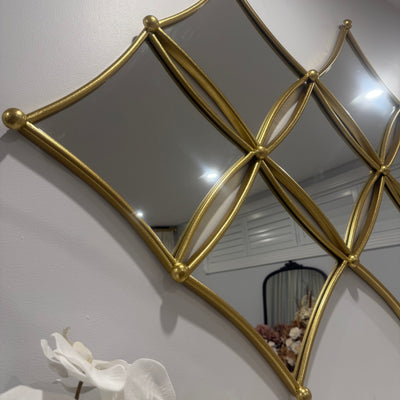 Diamond shaped wall mirror