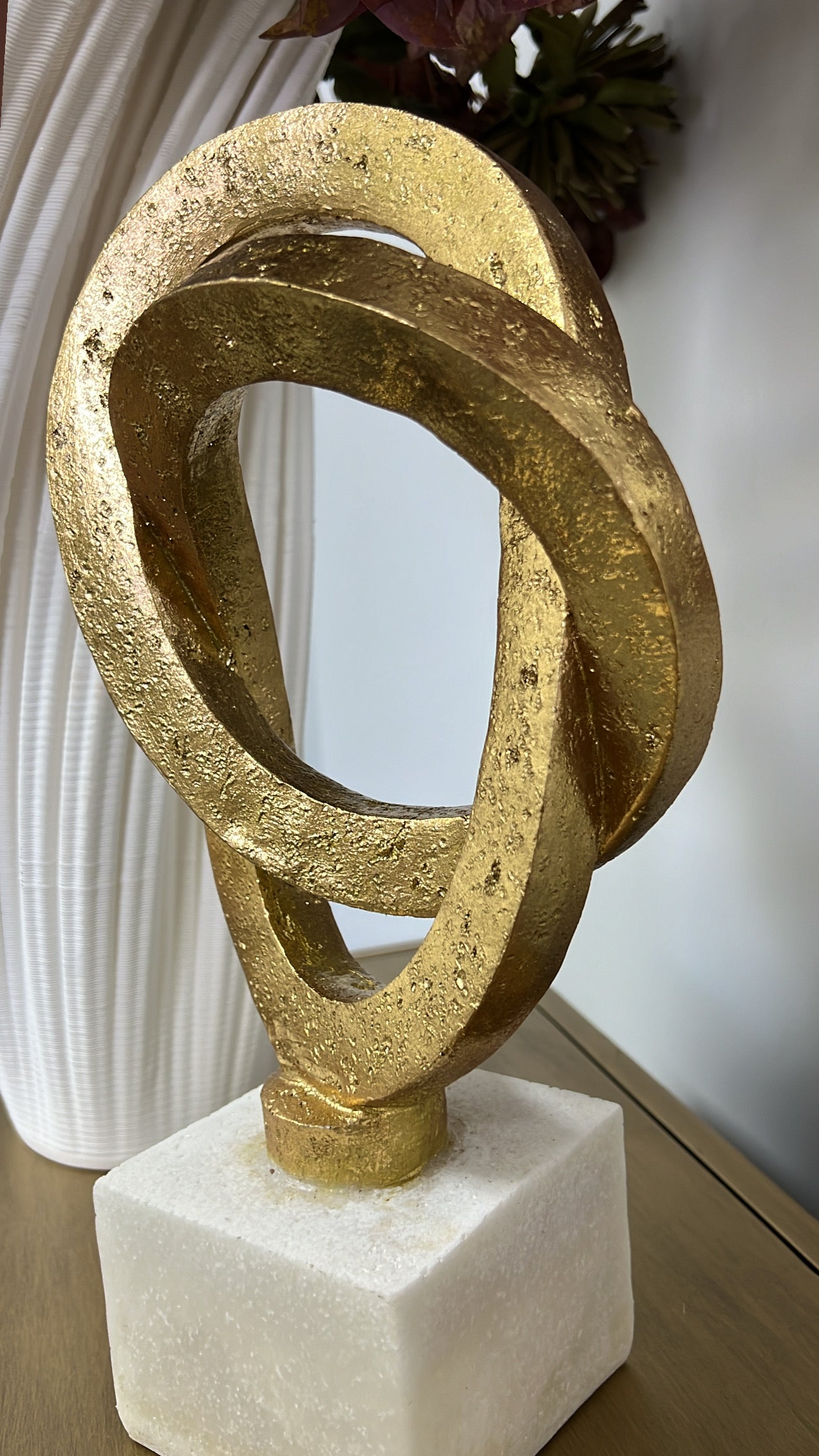 Gold loop sculpture abstract