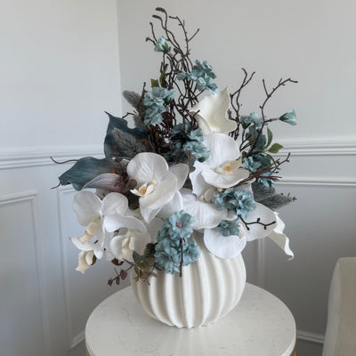 Iceblue blooms flower Arrangement