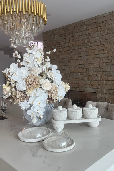 White stone round serving cake + dome