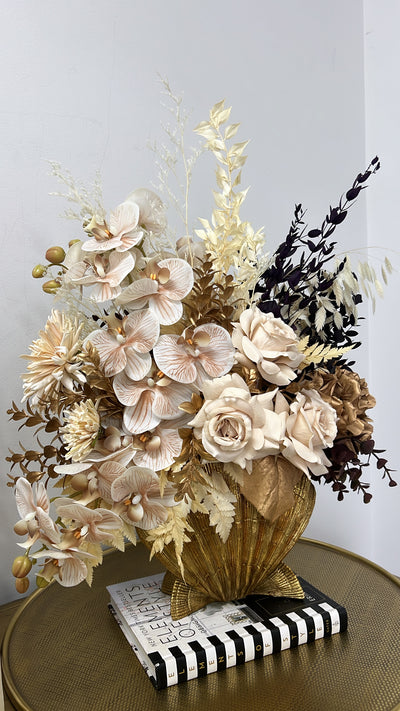 Golden shell floral arrangement