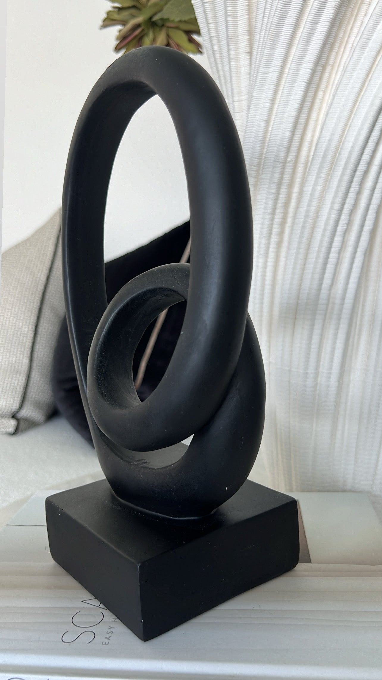 Black loop sculpture abstract