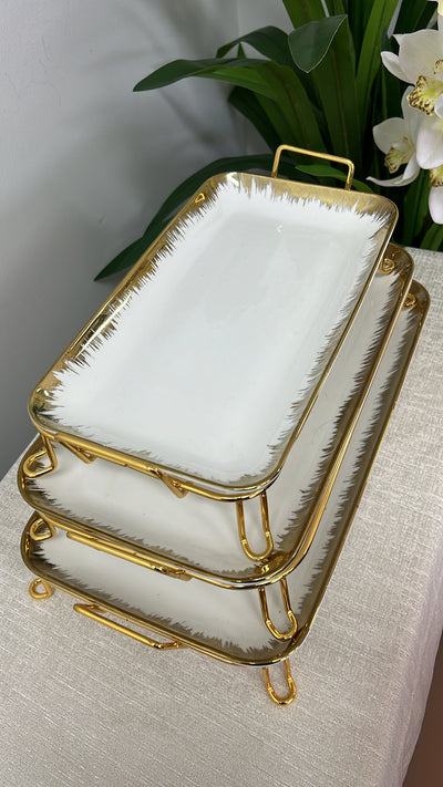 gold and white rectangular rack serving platter