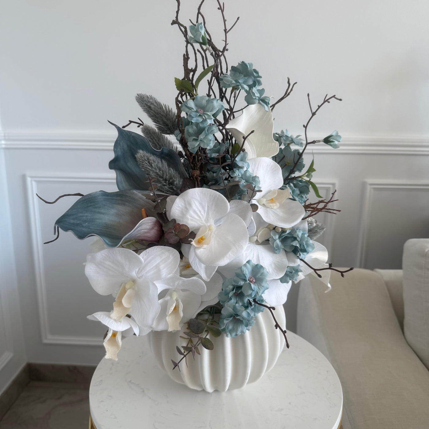 Iceblue blooms flower Arrangement