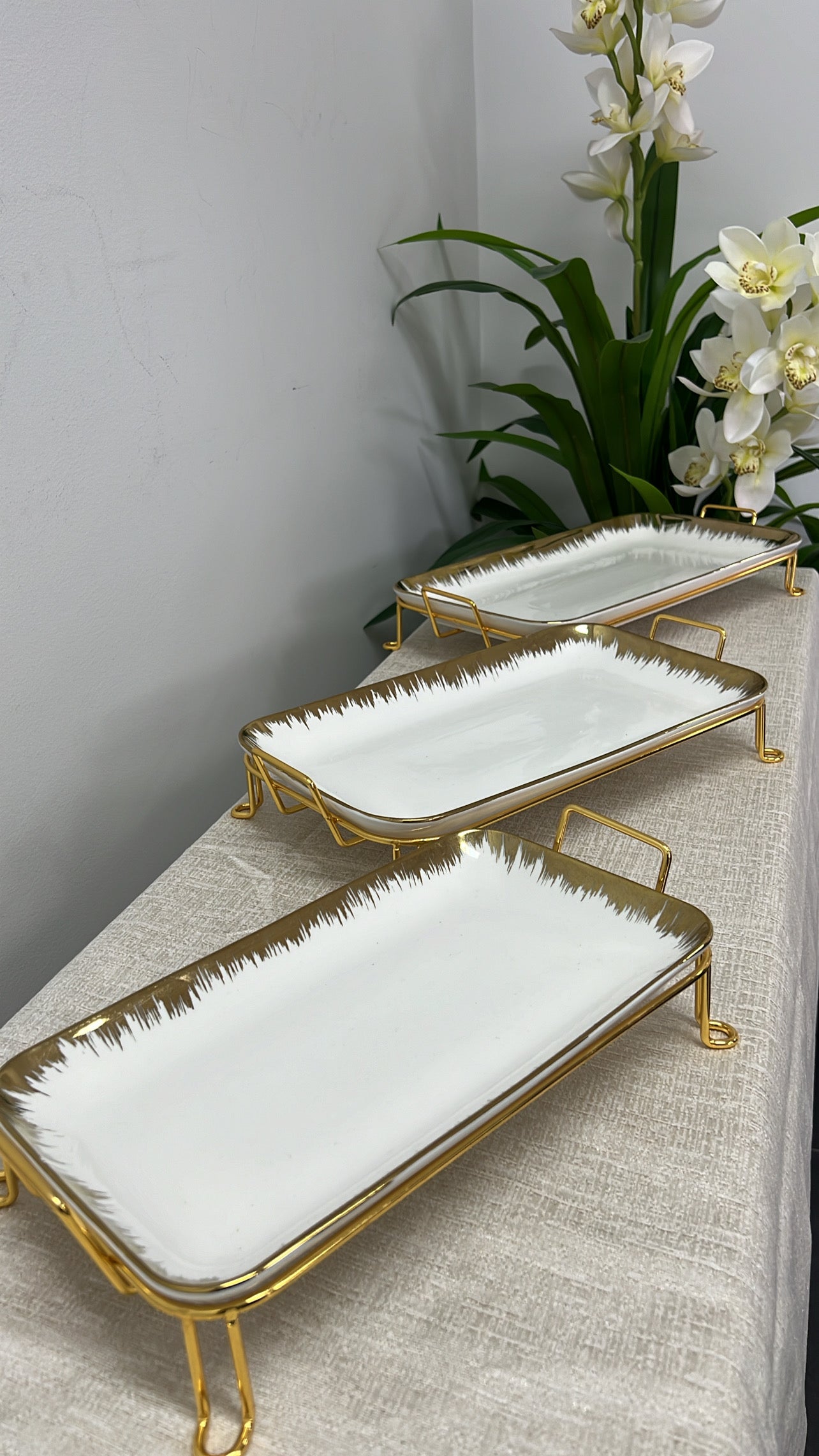 gold and white rectangular rack serving platter