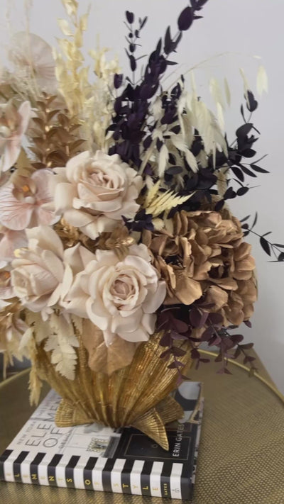 Golden shell floral arrangement